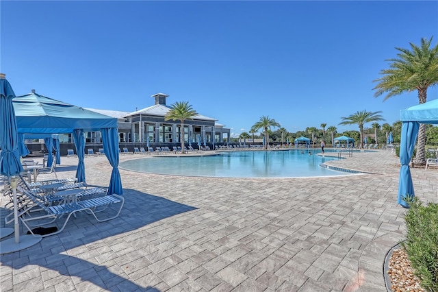 view of swimming pool featuring a gazebo and a patio