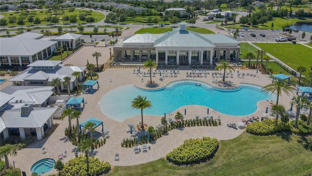 view of swimming pool with a lawn and a patio area