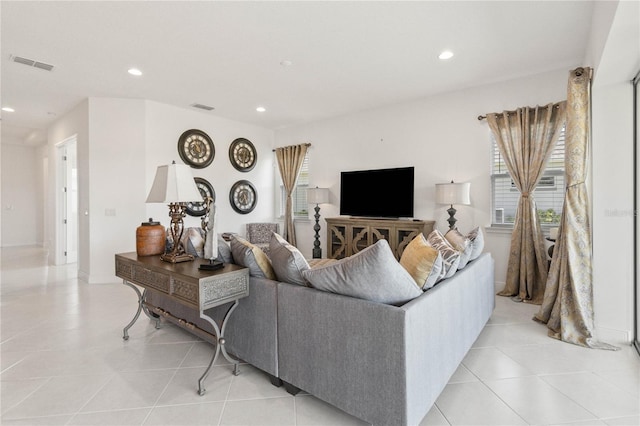 living room featuring light tile floors