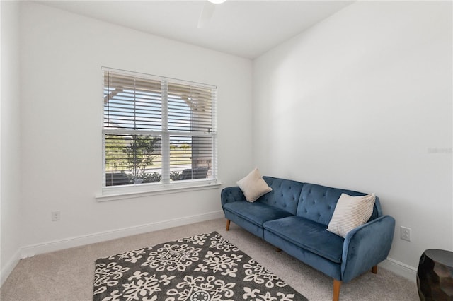 sitting room featuring light colored carpet