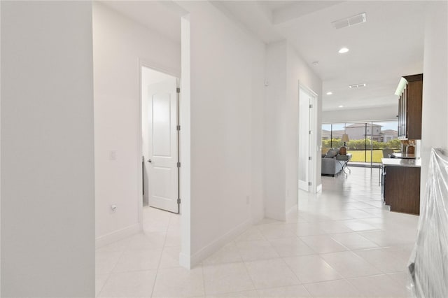 hall with light tile flooring