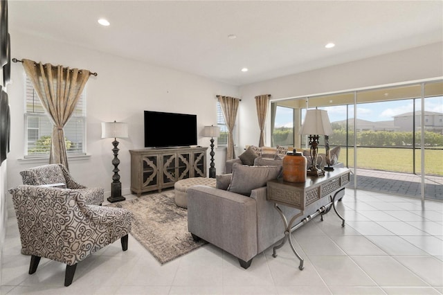 tiled living room featuring a healthy amount of sunlight