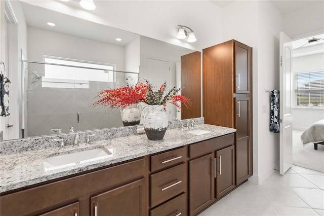 bathroom featuring tile flooring and dual bowl vanity