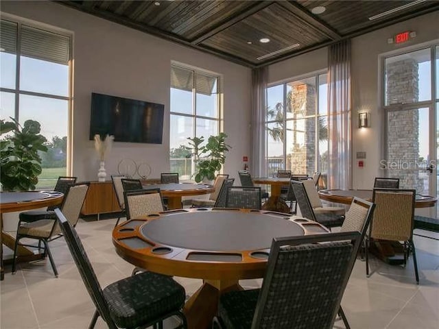 rec room featuring light tile floors and wooden ceiling