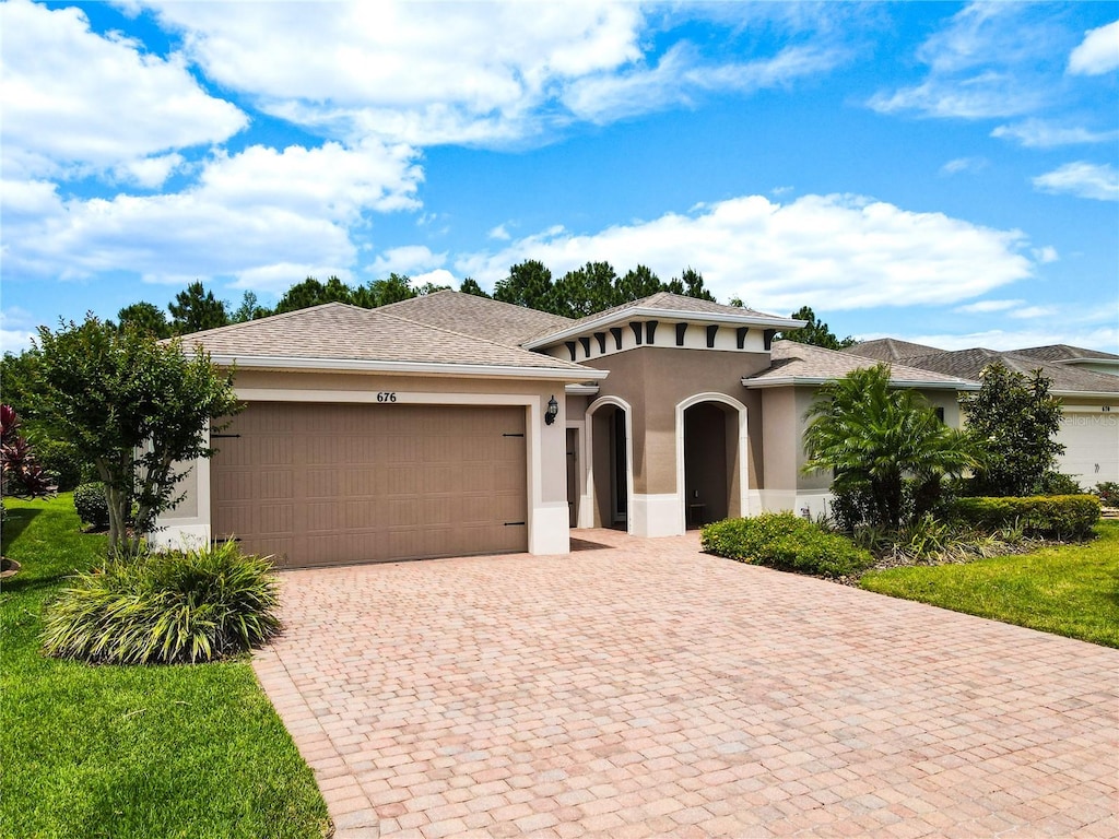 view of front of property with a garage