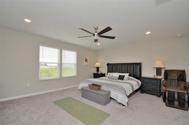 bedroom featuring ceiling fan and light carpet