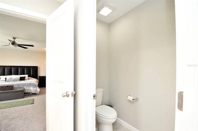 bathroom featuring ceiling fan and toilet