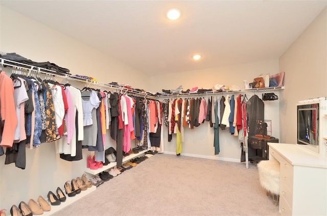 spacious closet with carpet