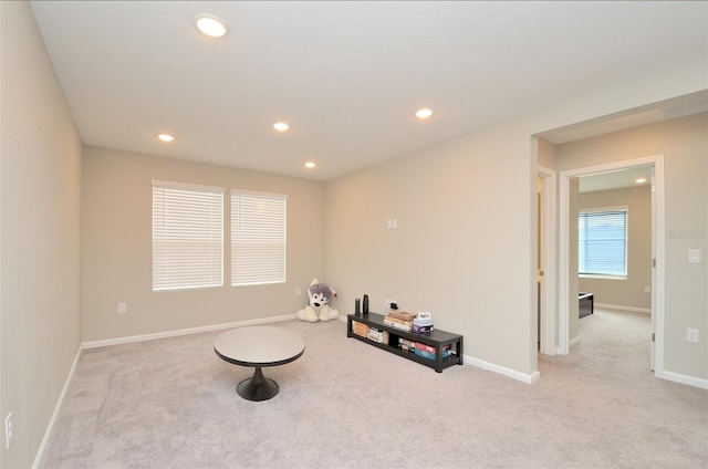 interior space featuring light colored carpet