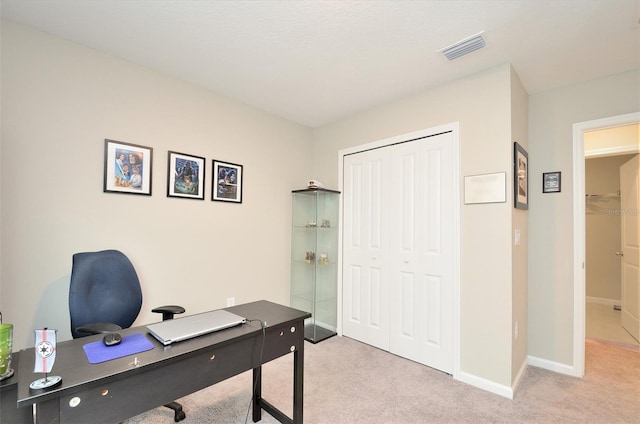 home office featuring light carpet