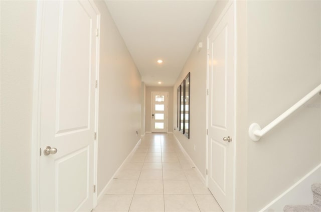 corridor featuring light tile patterned flooring