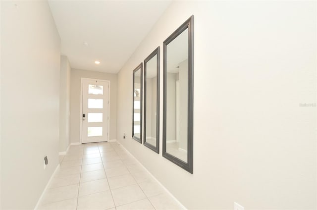 doorway with light tile patterned flooring