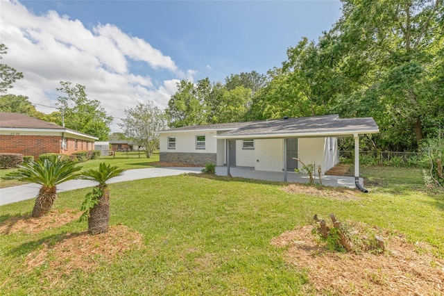 rear view of property with a yard