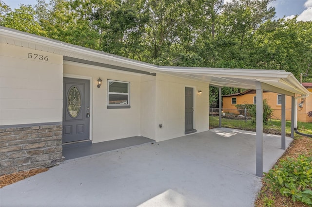 entrance to property with a carport