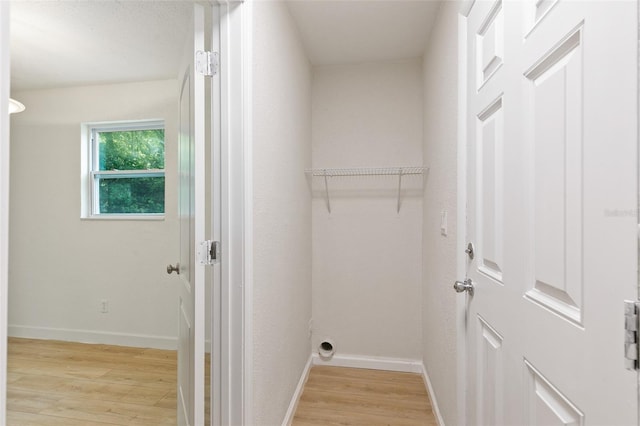 laundry room featuring light hardwood / wood-style flooring