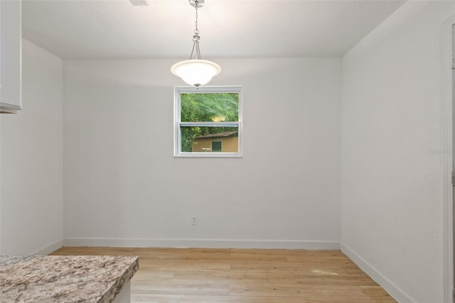 empty room featuring light hardwood / wood-style floors