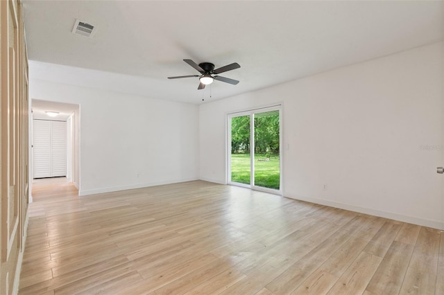 empty room featuring ceiling fan and light wood-type flooring