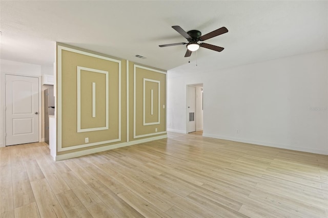 empty room with light hardwood / wood-style flooring and ceiling fan