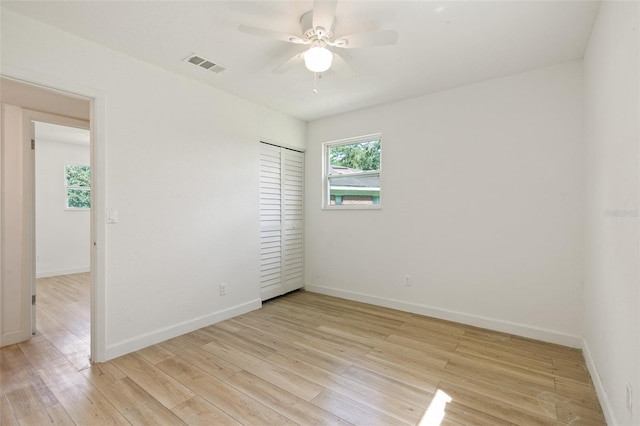 unfurnished room with light hardwood / wood-style floors and ceiling fan