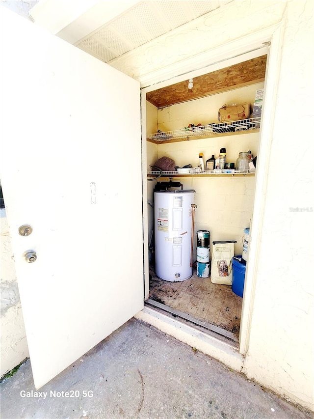 utility room with water heater