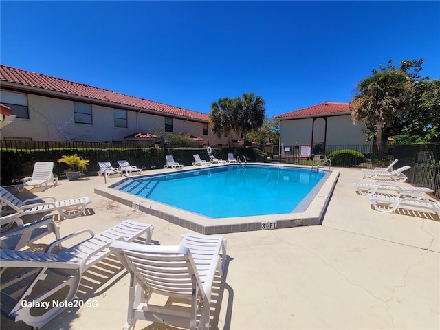 view of swimming pool featuring a patio