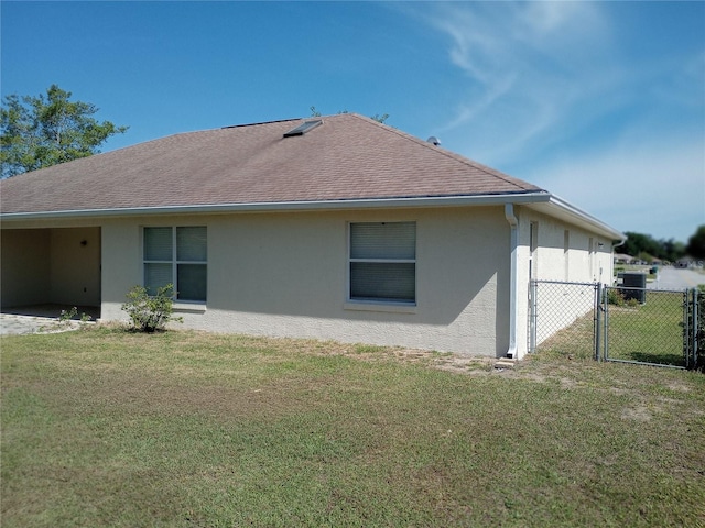 view of property exterior featuring a lawn