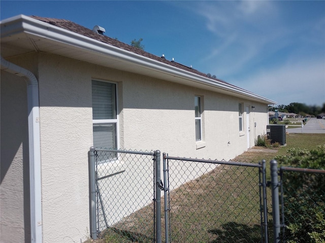 view of side of property with central AC