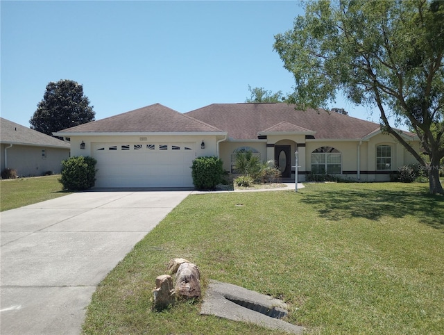 ranch-style house with a front yard and a garage