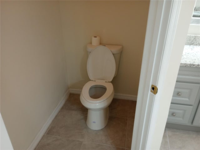 bathroom featuring toilet and tile floors