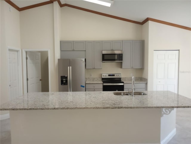 kitchen featuring appliances with stainless steel finishes, high vaulted ceiling, sink, and light stone counters