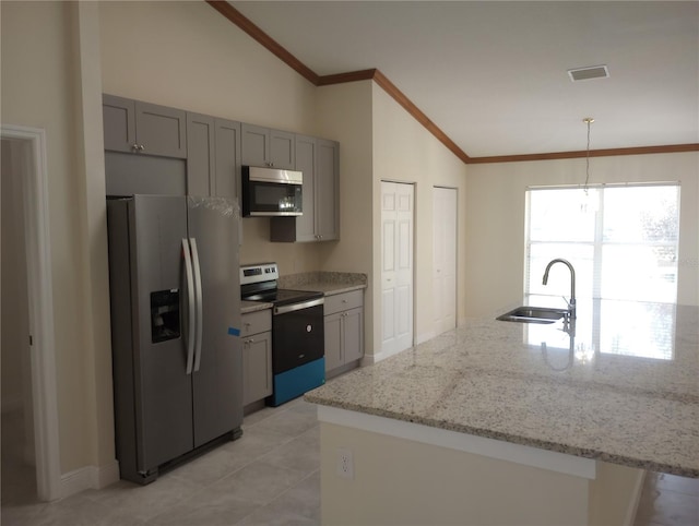 kitchen featuring light tile floors, sink, decorative light fixtures, stainless steel appliances, and vaulted ceiling