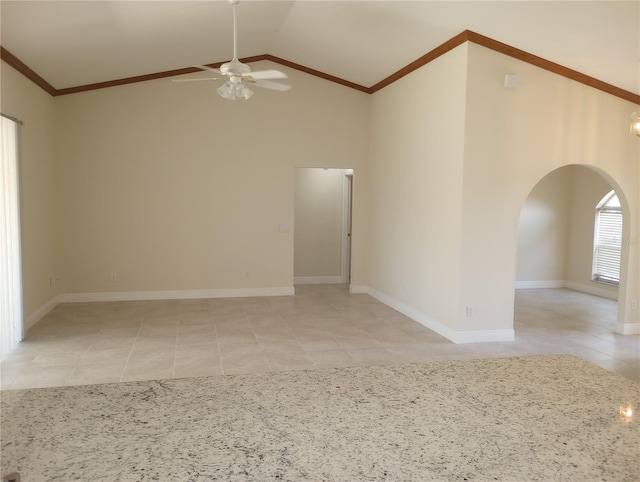 spare room with high vaulted ceiling, ornamental molding, ceiling fan, and light tile floors