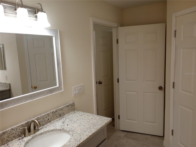 bathroom featuring oversized vanity and tile flooring