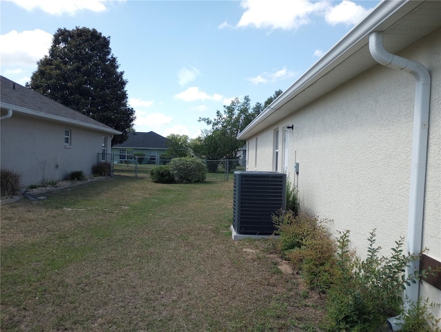 view of yard featuring central air condition unit