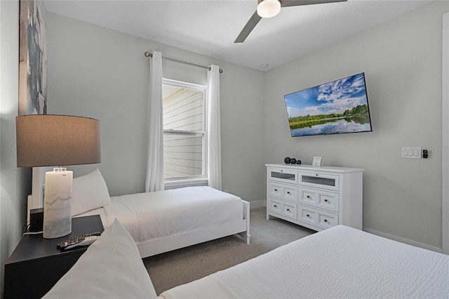 bedroom with ceiling fan and light carpet