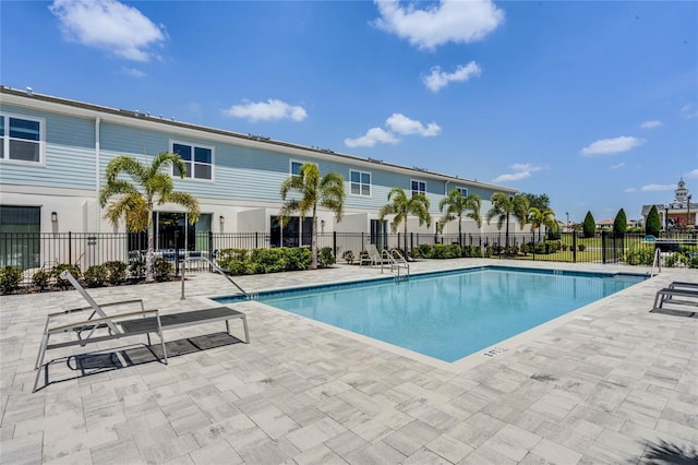 view of swimming pool featuring a patio area