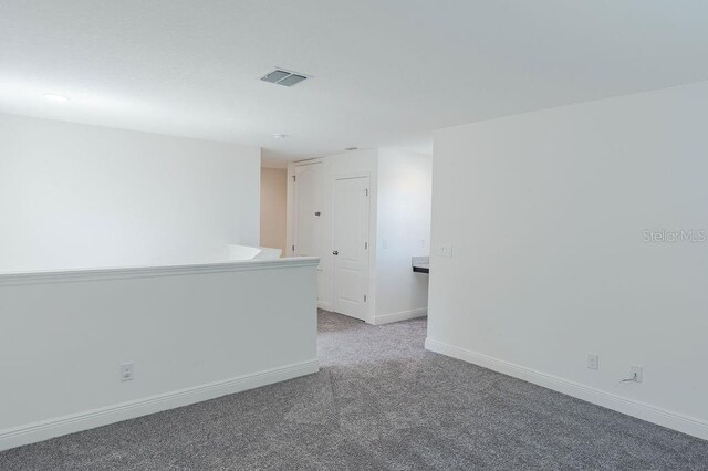 empty room featuring carpet floors