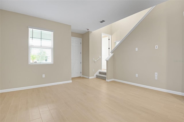 unfurnished living room with light hardwood / wood-style flooring