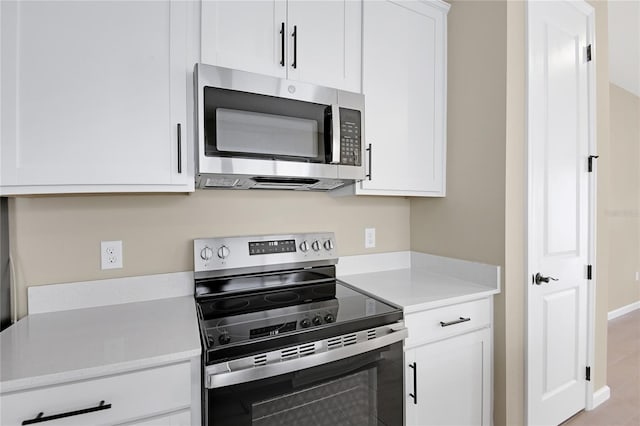 kitchen with white cabinets and stainless steel appliances