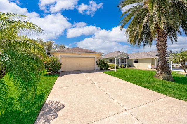 view of front of house with a garage and a front yard