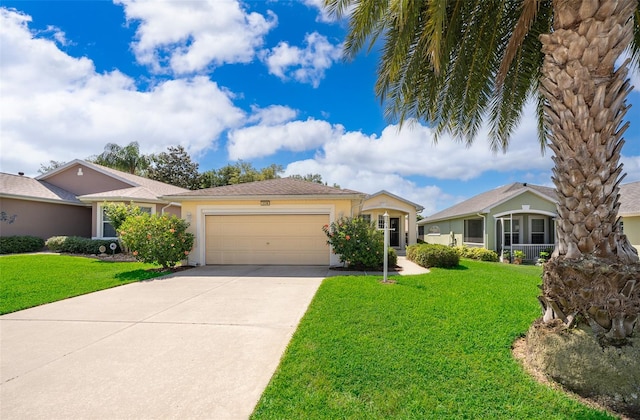 single story home with a front lawn and a garage