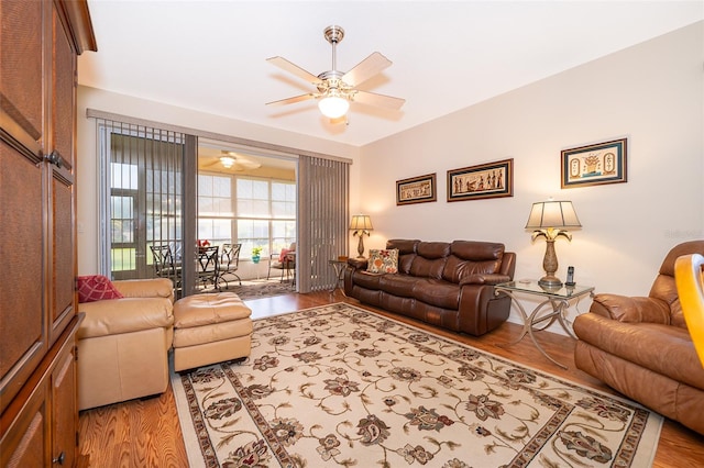 living room with ceiling fan and light hardwood / wood-style floors