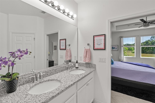 bathroom featuring dual sinks, tile floors, oversized vanity, and ceiling fan