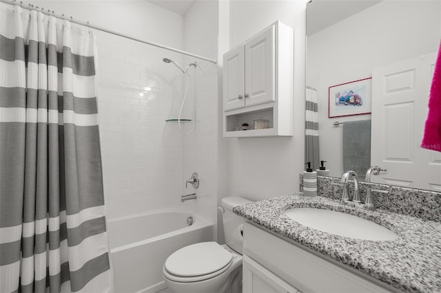 full bathroom featuring vanity, shower / bath combination with curtain, and toilet