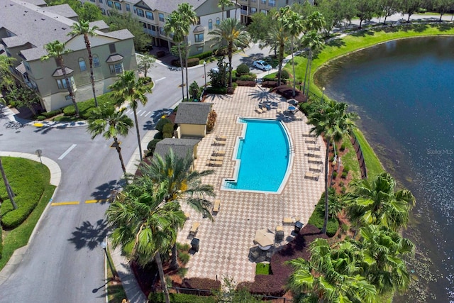 birds eye view of property with a water view