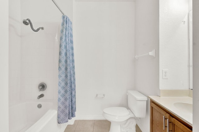 full bathroom with tile floors, vanity, shower / tub combo, and toilet