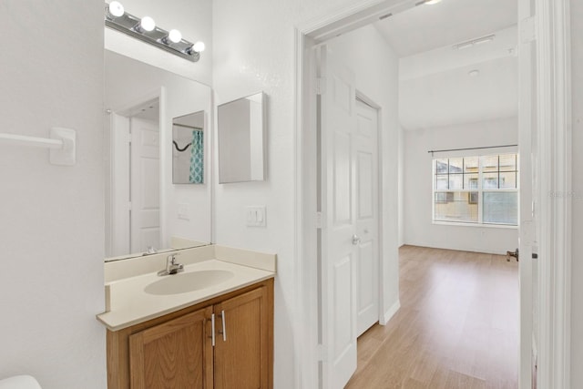 bathroom with wood-type flooring and vanity