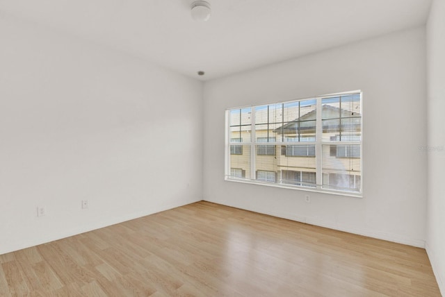 spare room featuring light wood-type flooring