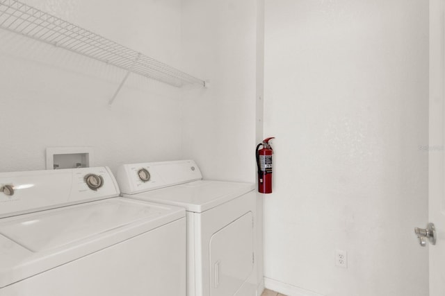 laundry room featuring washing machine and dryer