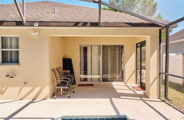 2726 Randal Way, Kissimmee, FL 34743 - back of property featuring stucco siding, a patio, and a shingled roof